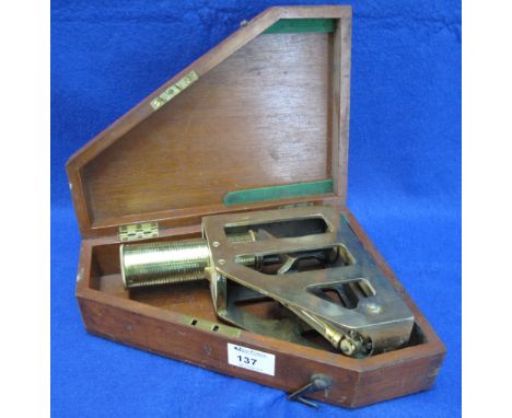 Heavy brass Clinometer in original fitted mahogany box. CONDITION REPORT: Scratches and wear overall. Made by E. R Watts & So