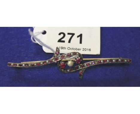 Edwardian ruby and pearl set scrolled bar brooch.