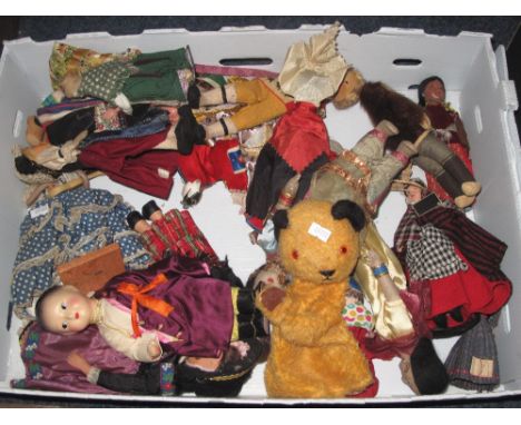 Tray of assorted Continental and Oriental dolls, Sooty hand puppet etc.