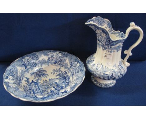 19th Century blue and white jug and basin, mark to base: Oriental, W.T.H., depicting figures in Oriental landscape with flora