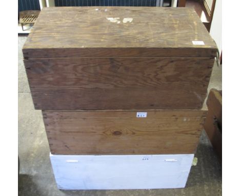 Two similar wooden trunks with rope handles together with a painted two handled trunk. (3)