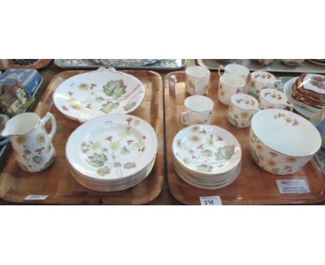 Two trays of floral and foliate teaware to include: teacups and saucers; milk jug; sucrier and various plates. (2)