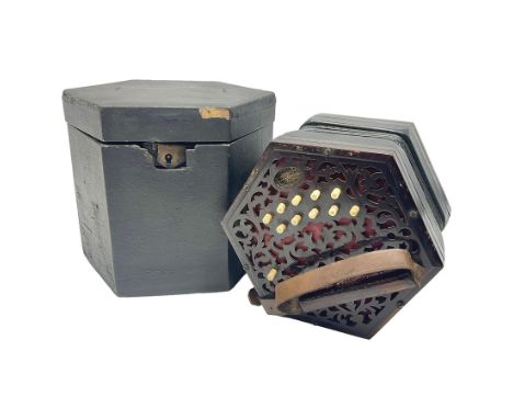 Lachenal & Co two-row concertina, with twenty-one buttons on pierced mahogany hexagonal ends; five-fold bellows and inset mak