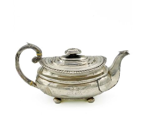 A George III Scottish silver teapot by George McHattie . Raised on four ball feet, gadrooned rim, square section spout, leaf 