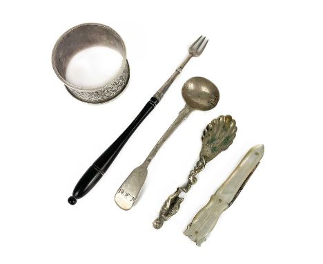 A George IV silver mustard spoon, London 1823. Together with a Dutch silver caddy spoon, an Edwardian napkin ring, a folding 