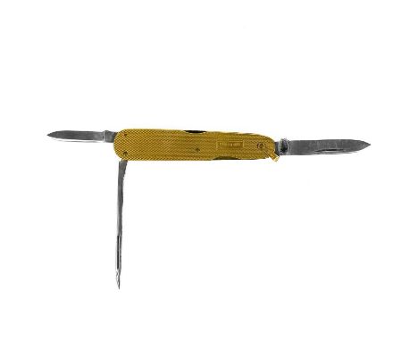 A 9ct gold cased combination pocket knife. With engine turned decoration, with three folding stainless steel blades, maker SJ