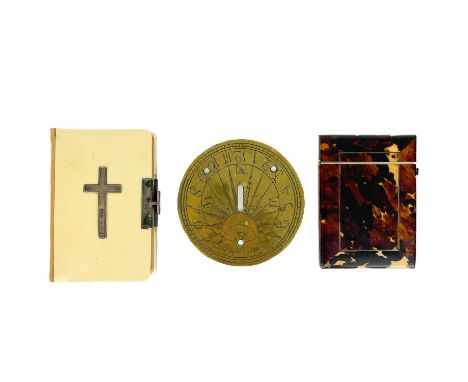 A Victorian tortoiseshell card case, a prayer book and a brass sundial. The card case length 10.5cm, the prayer book with ivo