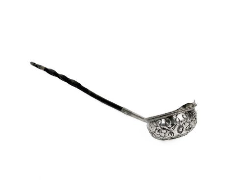 A Georgian silver toddy ladle with baleen handle. The foliate embossed bowl inset with a 1702 Queen Anne 'VIGO' shilling, len