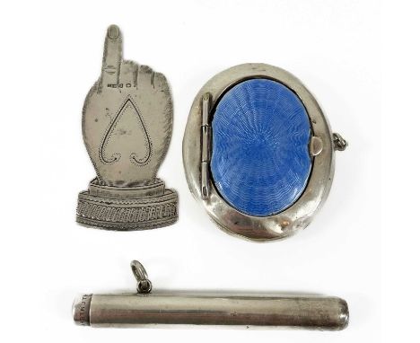 An Edwardian silver novelty bookmark, a cigar pricker and a silver and enamel compact. The bookmark in the form of a hand, by