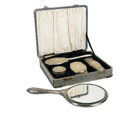 A George V silver child's cased four piece dressing table set. With engine turned decoration, Birmingham 1927 (damages); toge