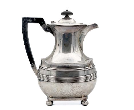 A George V silver hot water pot by Harrison Brothers &amp; Howson. Of oval baluster section with reeded banding, raised on ba