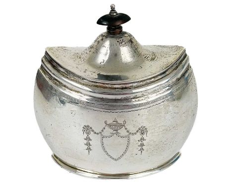 An Edwardian silver hinge lidded tea caddy by Walter &amp; John Barnard. In Georgian style, of boat shape with bright cut eng