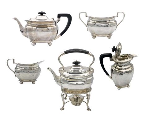 A good silver five piece tea set by Harry Atkins. Comprising spirit kettle, teapot, hot water jug, milk jug and sucrier, of f