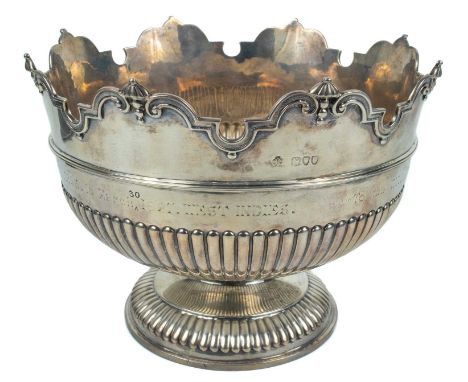 A Victorian silver Monteith style punch bowl by William Hutton &amp; Sons Ltd. Of half fluted form with shaped scroll cast ri