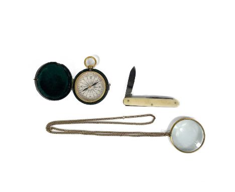 A 19th century brass lacquered pocket compass within case. Together with a monocle on gilt chain and a bone handled folding p