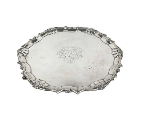A George II silver salver by Robert Abercromby. Of circular form, pie crust, raised on three hoof feet, London 1739, width 25
