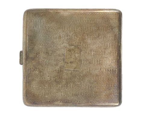 A George VI silver engine turned compact. Of square hinged form, the interior lid with mirror, width 7.5cm, 108g.