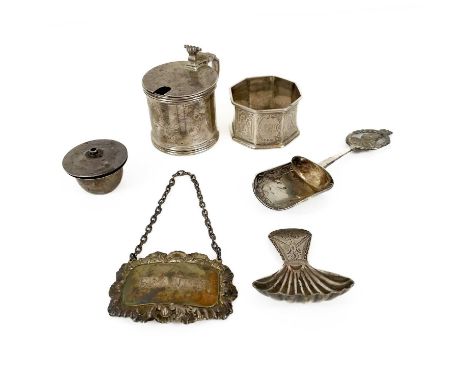 A selection of silver items. To include a George III caddy spoon with scallop bowl, London 1794, a Victorian napkin ring, a G