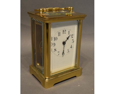 A French Brass Cased Carriage Clock, the enamel dial with Arabic numerals and with lever escapement, 11cm tall 