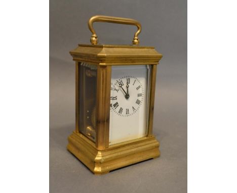 A French Brass Cased Miniature Carriage Clock, the enamel dial with Roman numerals and with lever escapement, 8cm tall 