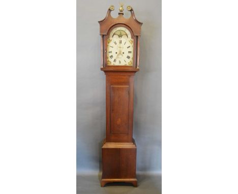 A George III Oak Longcase Clock, the arched hood with swan neck pediment and brass finial with turned pilasters above a recta