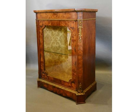 A Victorian Walnut Marquetry Inlaid and Gilt Metal Mounted Pier Cabinet with a glazed door enclosing a glass shelf, 77cm wide