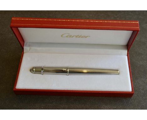 A Cartier Platinum Ballpoint Pen of ribbed form in original box 