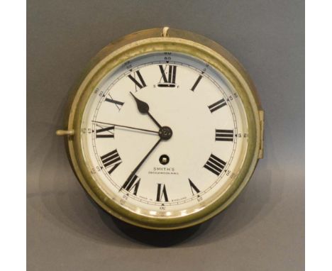 A Brass Ship's Clock by Smiths, Cricklewood, 18cm diameter 