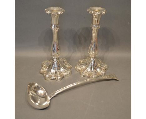 A Pair of Silver Plated Candlesticks by Hulkin &amp; Heath, together with a silver plated large ladle 