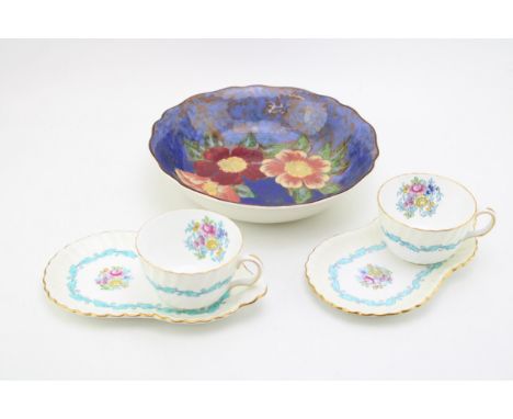 Two Minton cups and breakfast saucers in the Ardmore pattern together with a floral Royal Doulton bowl (5).