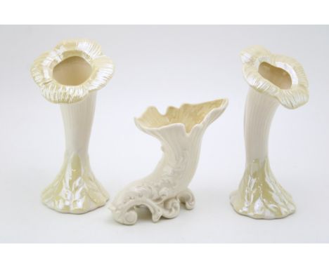 A pair of Belleek sunflower vases with openings with a cornucopia vase (3), 22cm tall.  In good condition with no obvious dam