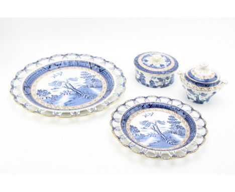 Booths Old Willow pattern items to include a large 33cm diameter pierced plate, a smaller example, a lidded sugar bowl and a 