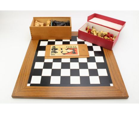 A vintage boxwood chess set by K&amp;C Ltd London, together with a vintage handmade chess set and a chessboard. (3)  All piec