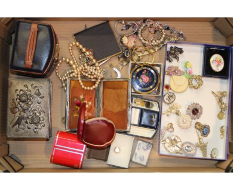 A collection of antique and vintage costume jewellery to include brooches, stick pins, compact, jewellery box, lady's watches