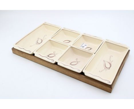 A Susie Cooper Hors D'oeuvres Set on Wooden Tray, 49cm Wide.  In good condition with no obvious damage or restoration.Provena