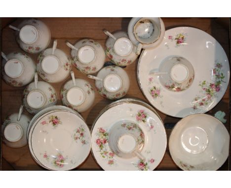 Early 20th century tea ware in fine bone china featuring pink cabbage rose pattern, containing eleven cups, twelve 18cm side 