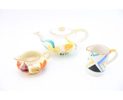 A collection of Susie Cooper and Grays pottery to include a daffodil teapot and two early jugs, one floral example and the ot