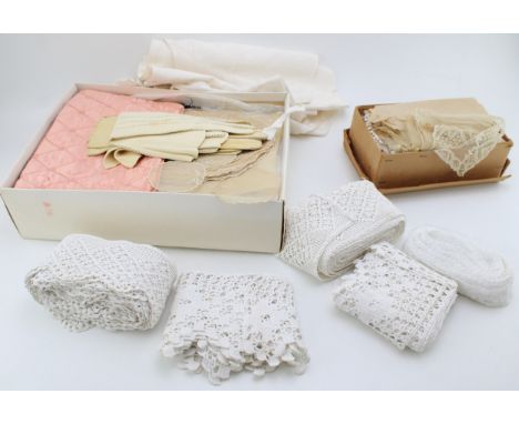 A large group of vintage linens and textiles including a christening robe, lace, embroidered net, table linens, an Art Deco s