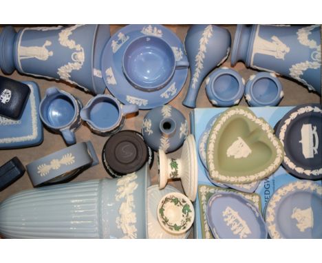 A collection of Wedgwood Jasperware and Queensware items to include clock, pin trays, vases and jugs in colours, blue, cobalt