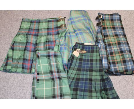 A collection of c20th vintage traditional Scottish Highland dress tartan wool kilts including three variations of Cameron Hun