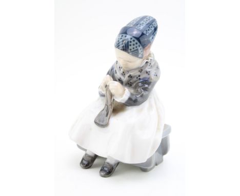 Royal Copenhagen figure depicting a girl darning, No.1314.  In good condition with no obvious damage or restoration.