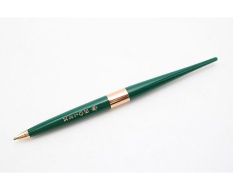 Rolex pen, bearing the Rolex emblem in gold.