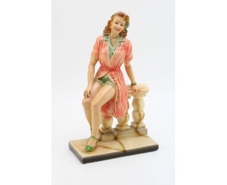 Art Deco ceramic figure of lady sitting on wall, RD No. 853543, height 30cm.  In goo hdoriignal condition showing very minima