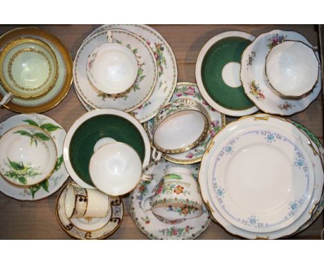 A collection of tea cups and saucers to include a Foley Bone China gilt and yellow example, a Crown Staffordshire Pagoda trio