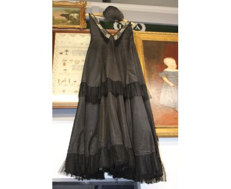 Black evening dress with diamanté decoration and lace detail with matching hat. (2)  Dress measurements, 14" chest 43" back.