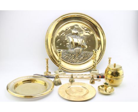 A collection of early c20th brass metalware including a large charger dish, candlesticks, pokers and various dishes, (Qty)  E