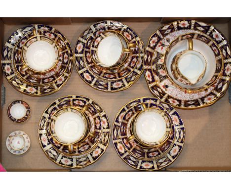 Royal Crown Derby 2451 Imari tea ware to include twelve cups, twelve saucers, twelve side plates, four cake plates, a cream j