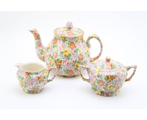 Art Deco period Wade Heath chintz pattern trio comprising of teapot, cream jug and lidded sugar bowl, 17.5cm tall. (3)  Of fi