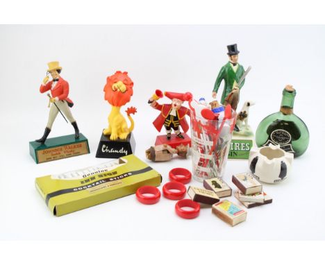 A collection of advertising and breweriana to include a Royal Doulton Sandeman ashtray, a Bretby Squire's Gin figure (chipped