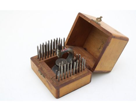 A vintage watchmakers tool set in a wooden box by Star of Switzerland  very good used condition and appears to be complete